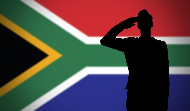 Silhouette of a soldier saluting against the south africa flag