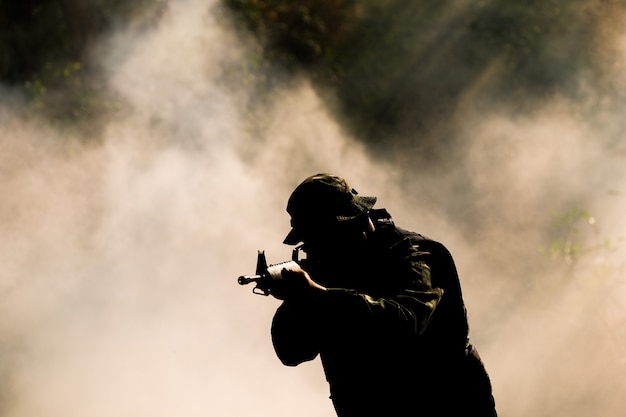 Silhouette of soldier with rifle