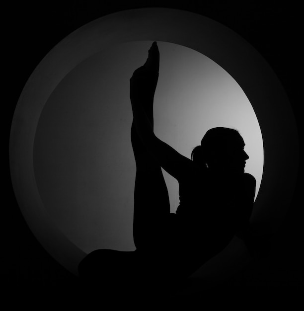 silhouette sporty woman in a circle