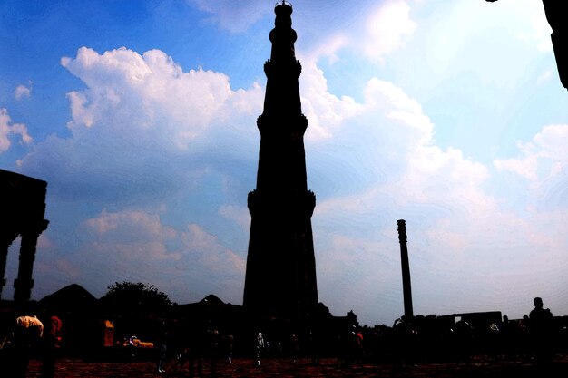 Silhouette statue against sky at sunset