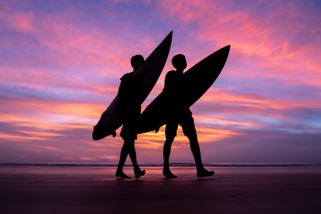 Silhouette surf athlete during sunset time at Phuket Thailand