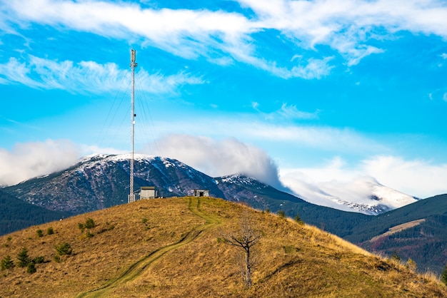 The silhouette of a telecommunications tower