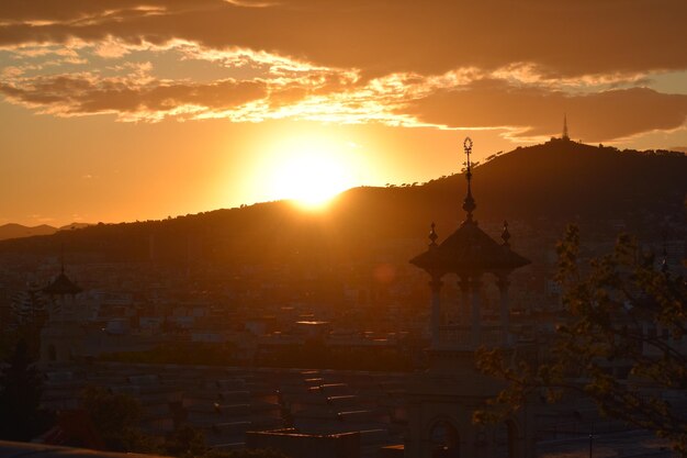 Silhouette temple against sky during sunset