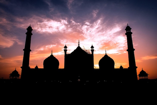 Photo silhouette of temple against sky during sunset