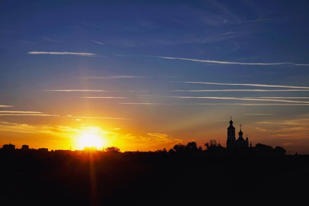 Photo silhouette of trees at sunset