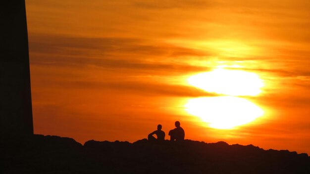 Photo silhouette of trees at sunset