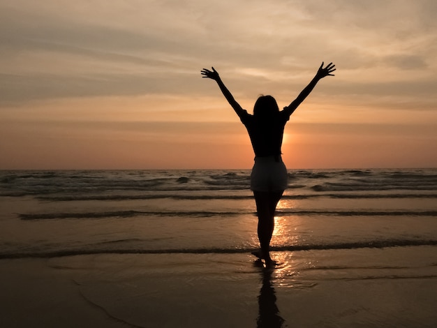 silhouette woman on the beach