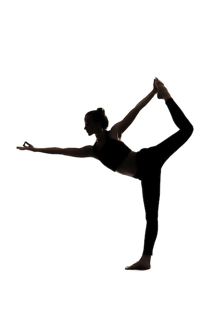 a silhouette of a woman doing yoga on a white background