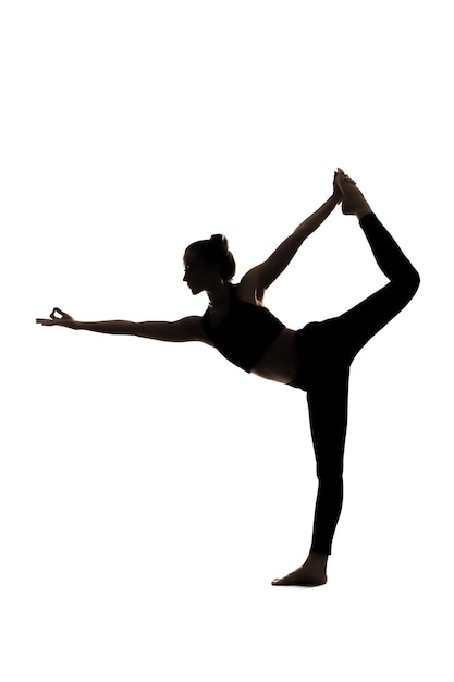 Photo a silhouette of a woman doing yoga on a white background