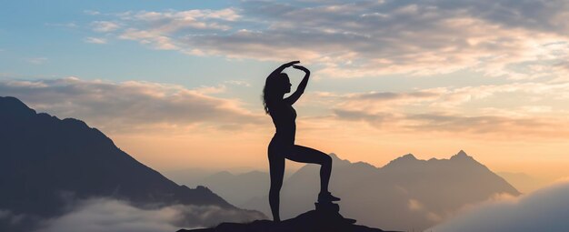 silhouette of a woman practicing yoga in the summit with mountain Background