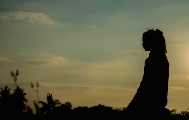 Silhouette woman pray to god