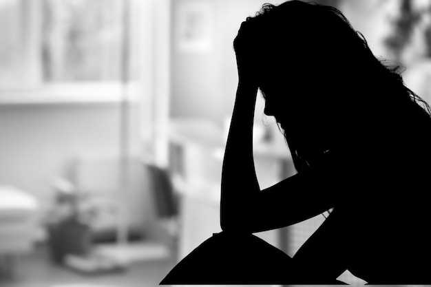 Silhouette of woman's head with waving hair,