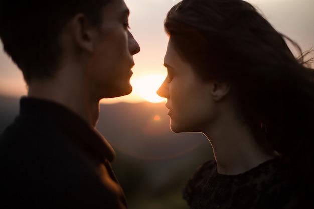 Silhouette of a young couple at sunset