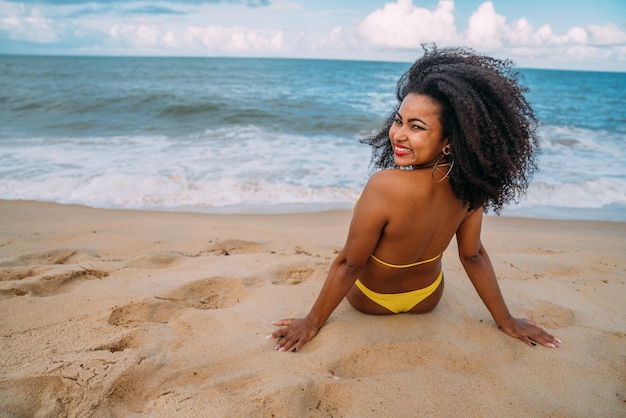 Silhouette of young woman on the beach