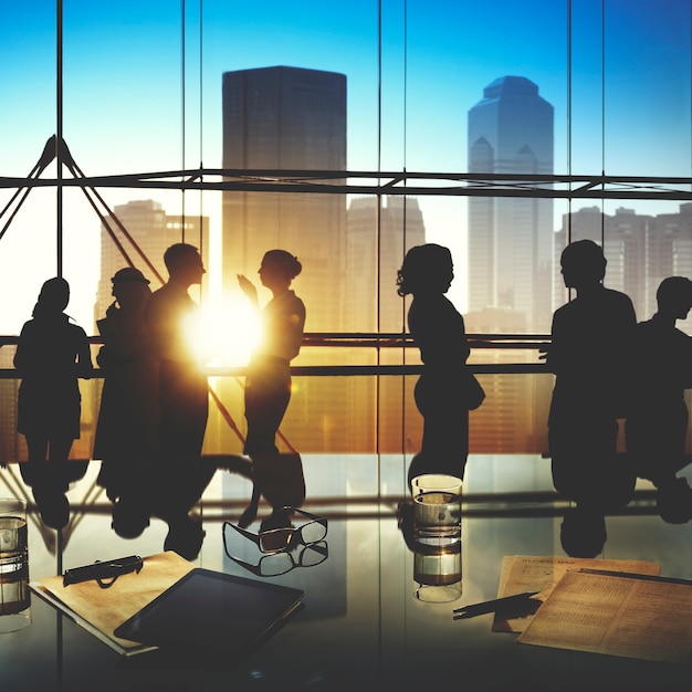 Silhouettes of Business People Brainstorming Inside the Office