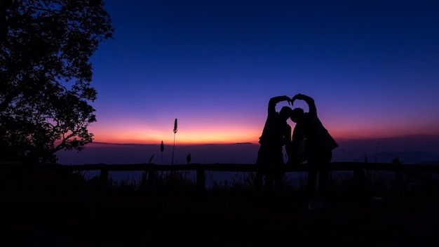 Silhouettes, couples taking pictures