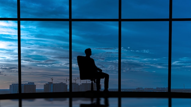 Silhouettes of people on a panorama background