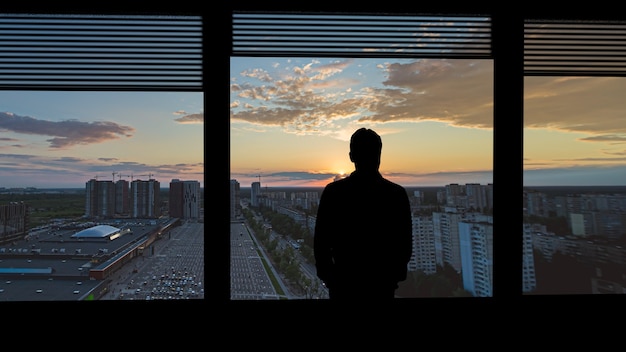 Silhouettes of people on a panorama background