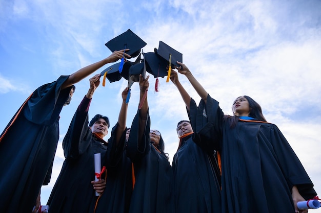 Silhouettes of students celebration education graduation\
student success learning concept ceremony at university