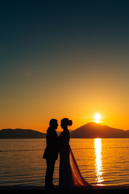 Silhouettes at sunset on the beach