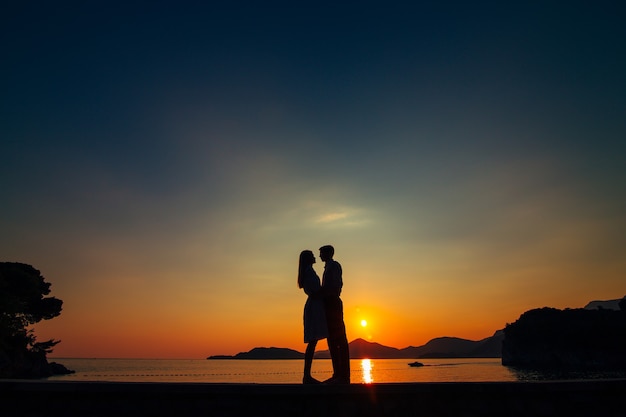 Silhouettes at sunset on the beach