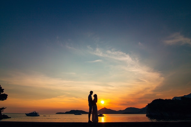 Silhouettes at sunset on the beach