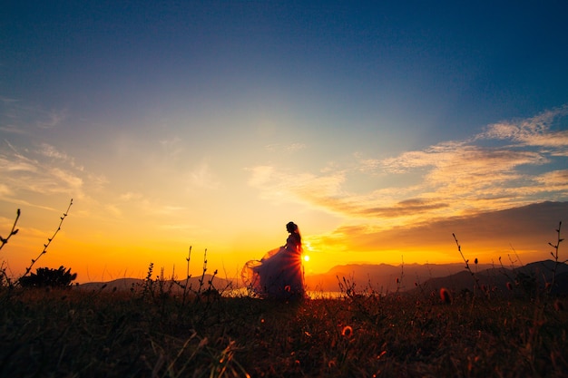 Silhouettes at sunset on mount