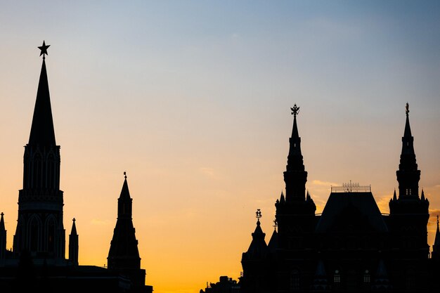 Silhouettes of towers near Moscow Kremlin on sunset