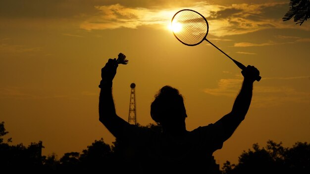 Silhouettes winner indian man playing badminton
