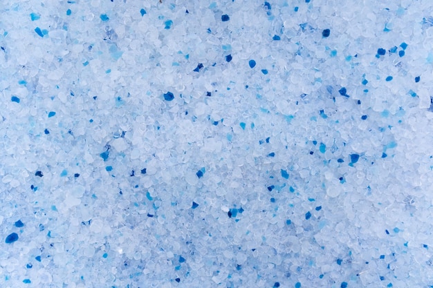 Silica gel litter for cat Background of white and blue granules Texture