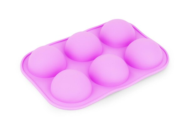 Silicone form for cooking muffin and cupcake on white background