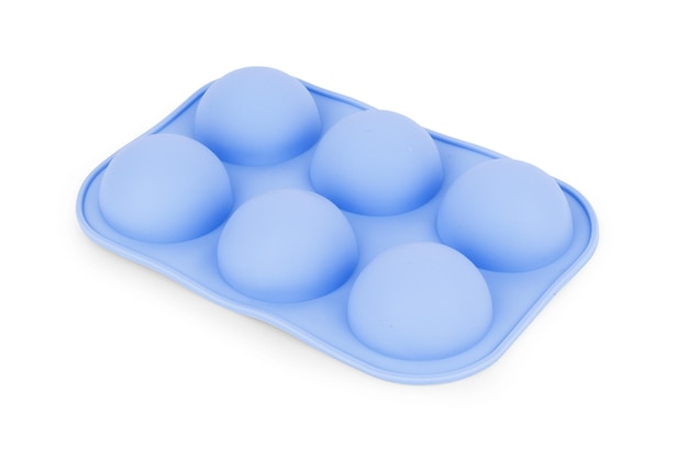 Silicone form for cooking muffin and cupcake on white background