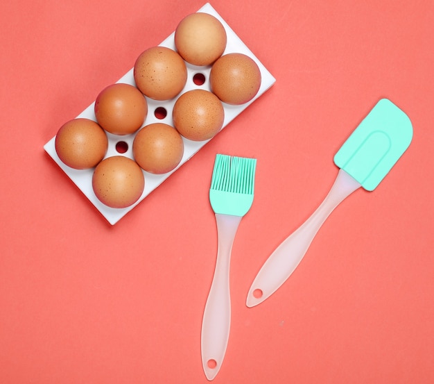 Silicone kitchen tools, tray of eggs as cooking concept