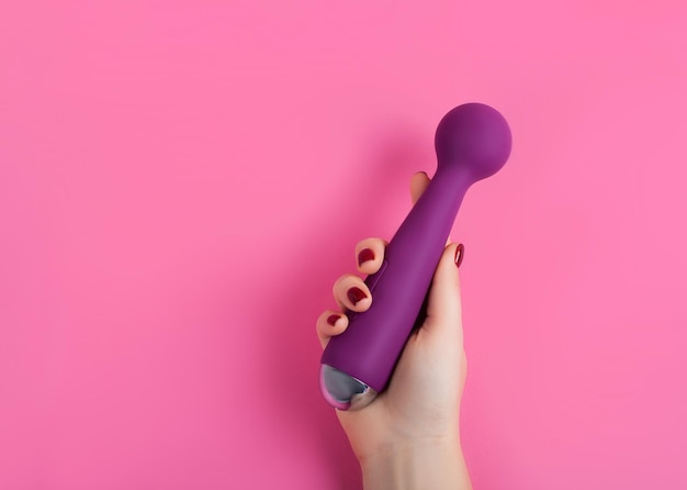 Silicone sex toys on a pink background. Erotic toy for fun. Sex gadget and masturbation device.