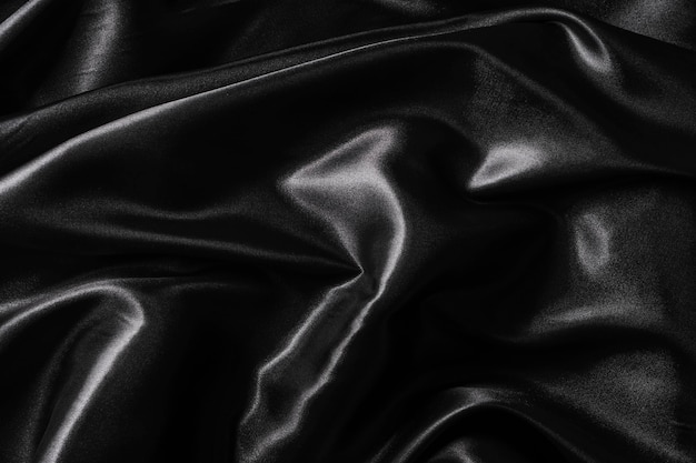 Silk fabric abstract wavy black satin fabric background