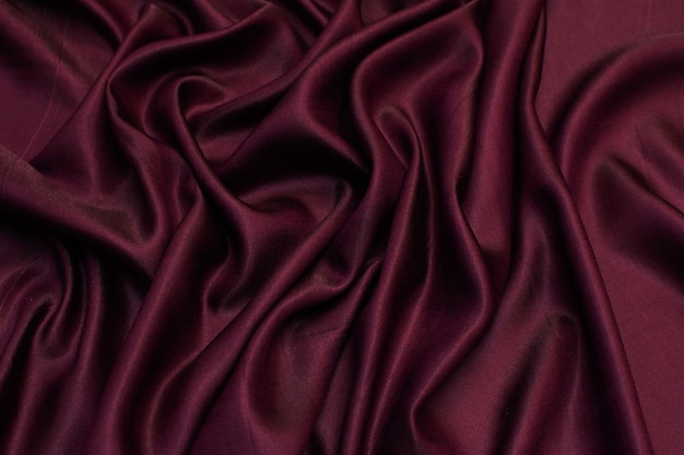 Photo silk fabric with viscose. color burgundy. texture,