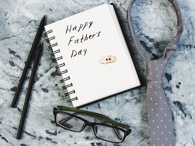 Silk tie, glasses, pen and notepad