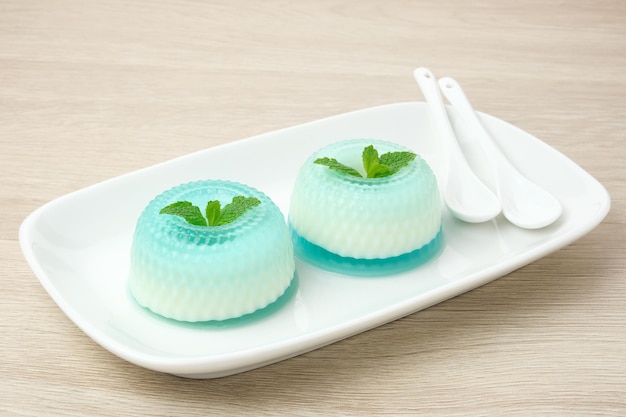Silky sweet lychee pudding topped with mint leaves