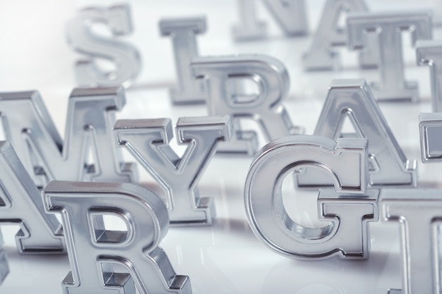 Silver alphabet letters close-up on a white background