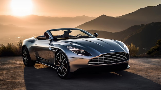 A silver aston martin car on a mountain road.