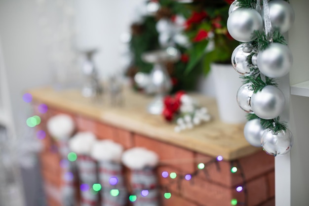 Silver baubles on spruce branches decorated for during Christmas