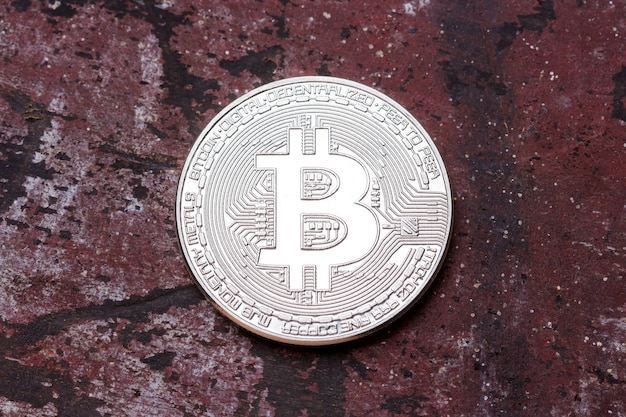 Silver bitcoin on red background High resolution photo