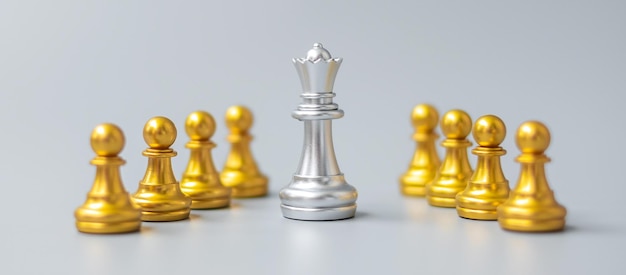 Silver chess king pieces or leader businessman stand out of crowd people of golden men leadership business team teamwork and Human resource management concept