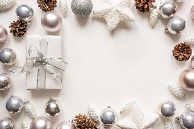 Silver Christmas decoration balls and gift on white