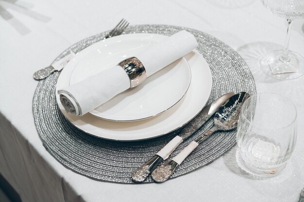 Photo silver christmas table setting on white table