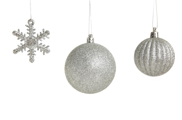 Photo silver christmas toys isolated on white background. top view