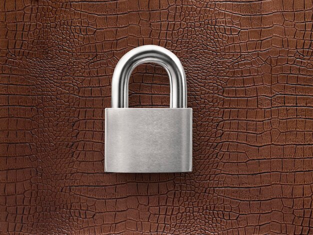 Silver closed lock on a brown leather background