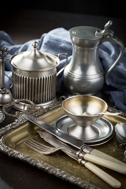 Silver dishes on old surface