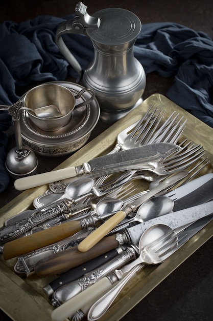 Silver dishes on old surface