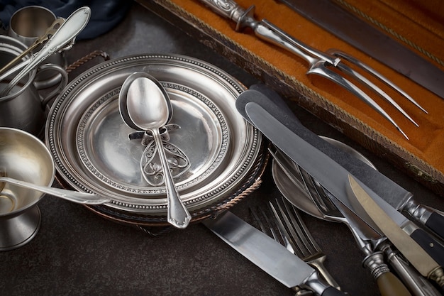 Silver dishes on old surface